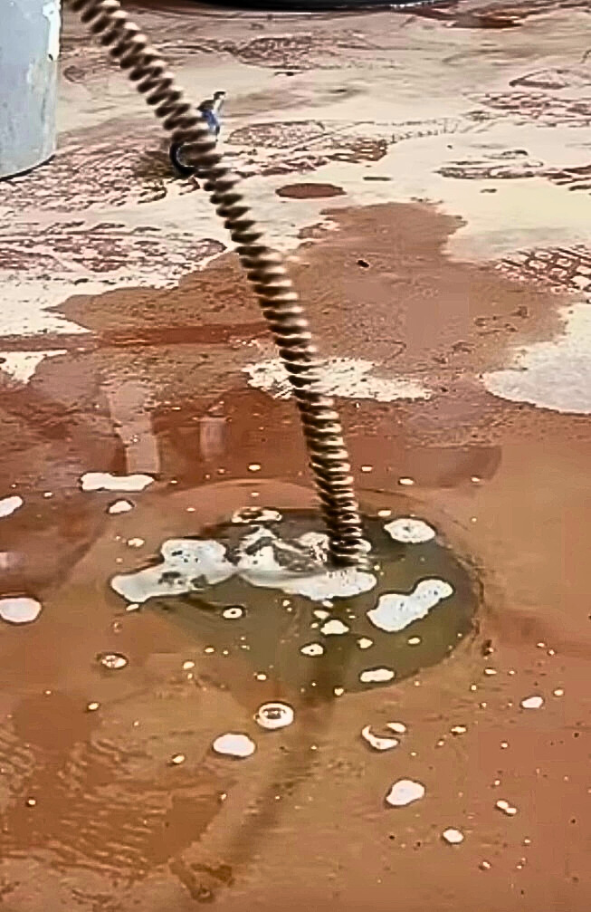 Professional drain cleaning service clearing a clogged sewer line in Mobile Alabama